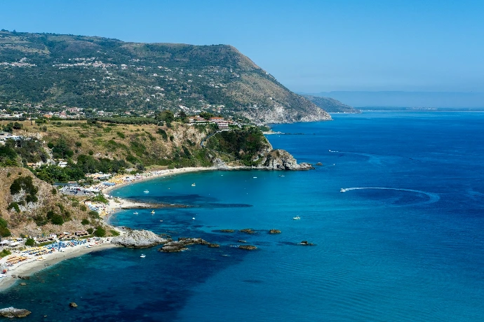 a view of a beach with a boat in the water