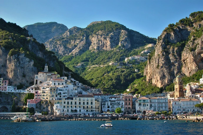 white and brown concrete buildings near body of water during daytime